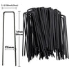 A bundle of black galvanized U-shaped garden staples for landscape fabric and netting.
