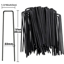 A bundle of black galvanized U-shaped garden staples for landscape fabric and netting.