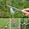 A hand holds a carbon steel manual weeding tool set featuring a sickle, weeder, and hand shovel in a garden setting.