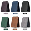 A set of magnetic leather wallet cases for iPhone in various colors including deep purple, dark blue, black, green, brown, an