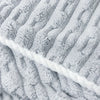 Close-up of a gray coral velvet bath towel with vertical ribbed texture.