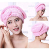 Pink microfibre quick-dry hair towel wrap with a bowknot shown on a model's head and shoulder.
