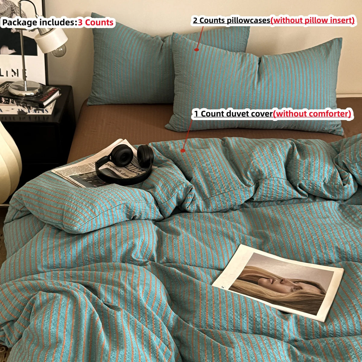 A set of striped teal and white bedding includes a duvet cover, pillowcases, and a duvet cover without a comforter.
