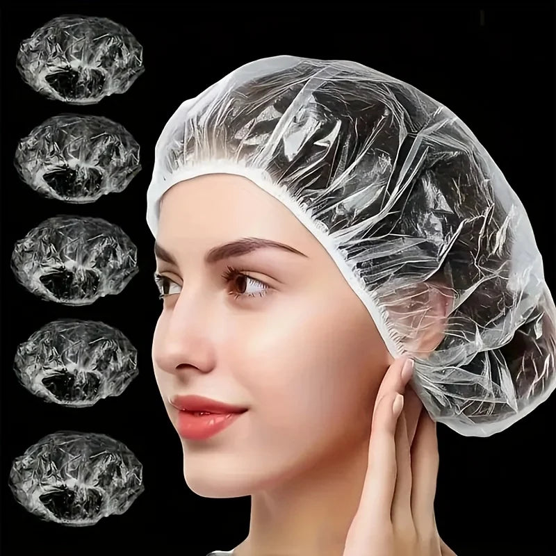 A woman is wearing a clear disposable shower cap for hair protection and salon use.