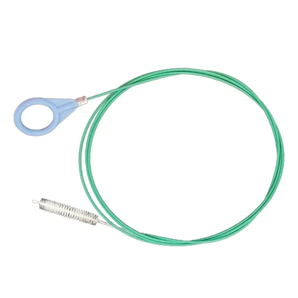 A flexible green hose with a cleaning brush attachment for car drain cleaning.