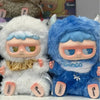 A fluffy white MONBOO collectible blind box featuring a cute face and blue accents.