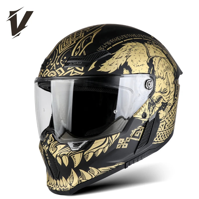 A black full-face motorcycle helmet with gold and black graphic designs and a clear visor.