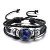 Black leather wrap bracelet featuring a glowing blue and purple zodiac sign charm.
