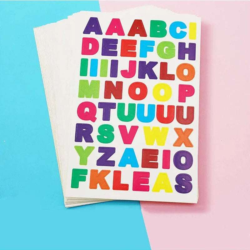 A sheet of colorful alphabet stickers arranged in a grid on a pink background.
