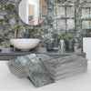 A stack of gray and beige marble self-adhesive wall stickers used as 3D tile decals in a bathroom setting.