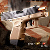 A tan compact pistol with a wooden stock and barrel visible in a desert-like outdoor setting.