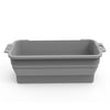 A rectangular gray reusable silicone grease liner for a griddle pan.