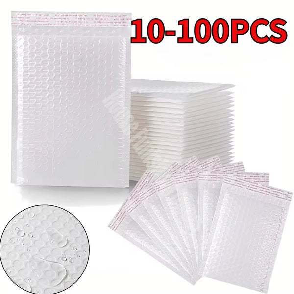 A stack of white padded bubble mailers with self-seal closures, showing the texture and quantity.