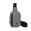 A gray water-resistant nylon chest sling bag with a black strap and adjustable buckle.
