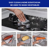 A set of scratch-free double-layer mesh cleaning cloths being used to wash vegetables under running water.