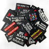 A collection of black embroidered iron-on patches with various funny text designs like I'm here to break and bad decisions ma