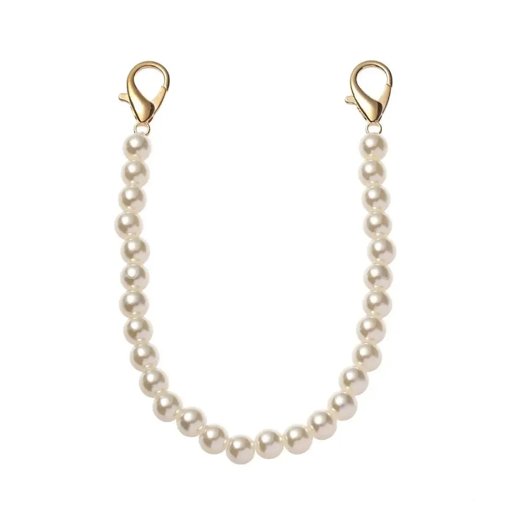 A delicate pearl strap replacement for handbags, featuring a beaded chain and gold-toned clasps.
