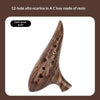 A dark wood grain alto ocarina in A key made of resin