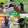 A black solar clip-on outdoor light with a motion sensor is shown attached to a wooden fence.