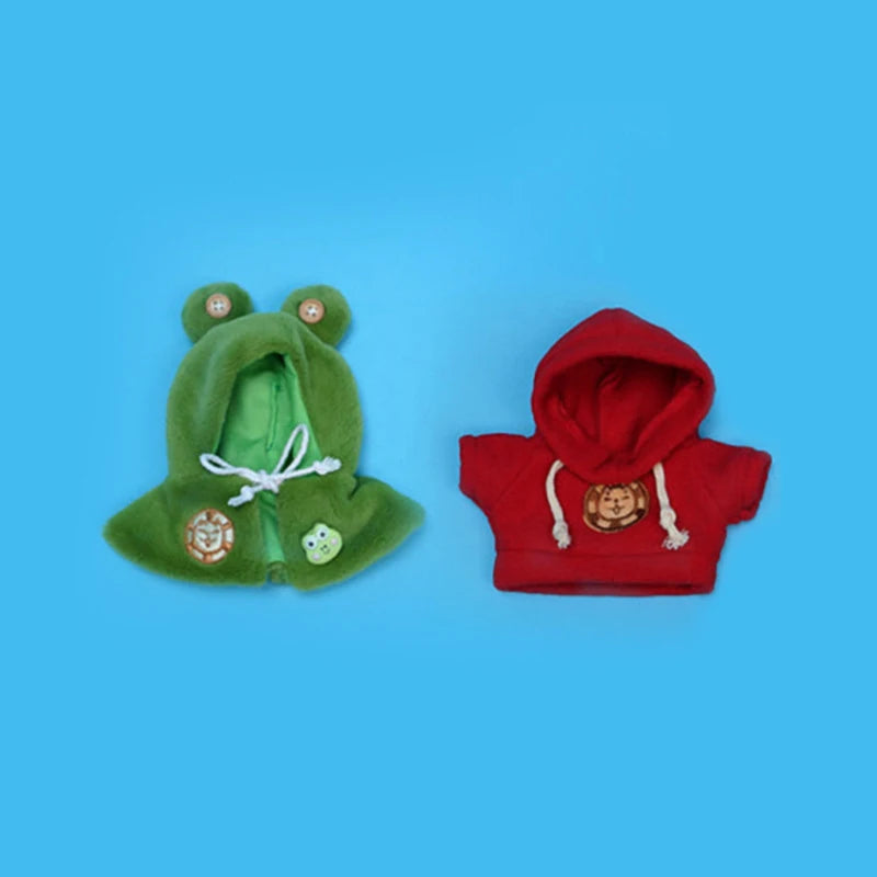 A set of green and red cloth apparel featuring an eiling robot design with embroidered details.