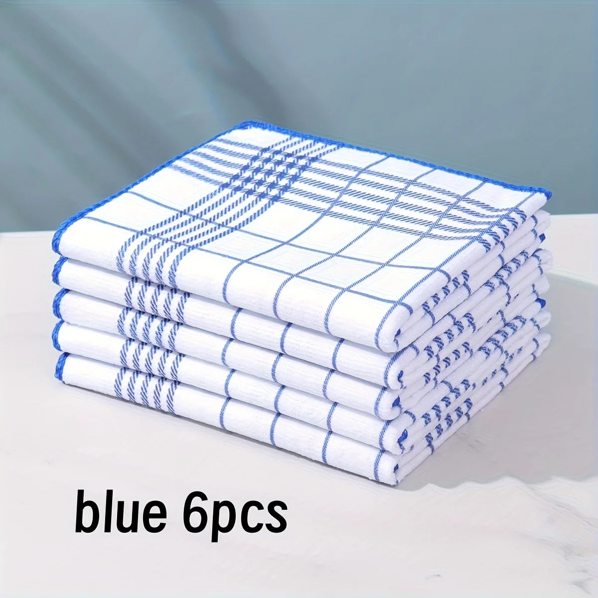 A stack of six blue checkered lint-free dish cloths or kitchen towels.