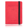 A red leather passport wallet with a black strap and the word passport embossed on the cover.