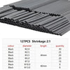 A collection of black heat shrink tubing of various diameters and lengths is shown in a close-up view.