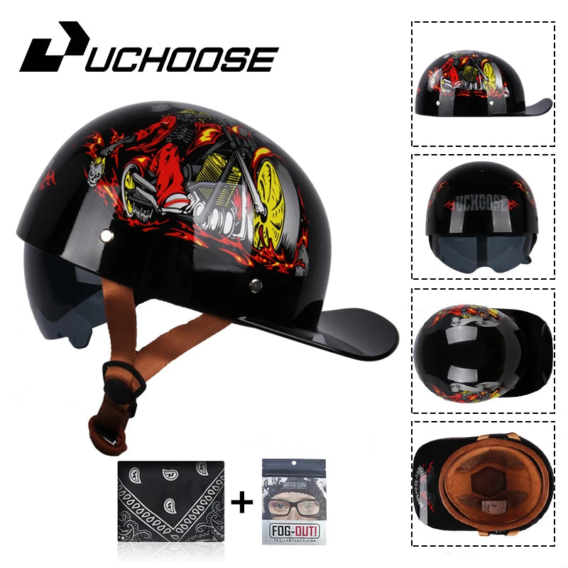 A glossy black motorcycle helmet featuring a fiery graphic design and an attached leather visor, shown alongside accessories.