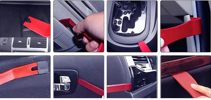 A set of red car trim removal tools and accessories for interior components with a storage pouch.