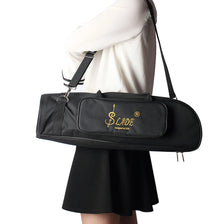 A black Slade trumpet bag is carried by a person wearing a white top and a black skirt.