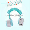 A turquoise stretchable wrist link strap for toddlers, shown coiled and uncoiled.