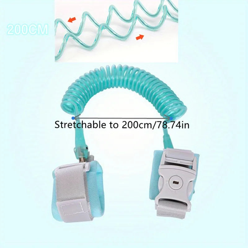 A turquoise stretchable wrist link strap for toddlers, shown coiled and uncoiled.
