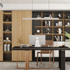 A modern office setup featuring wooden cabinetry, shelving, and a desk with a computer and plants.