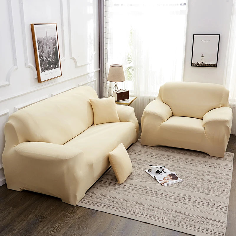 A light beige silky soft stretchable sofa cover for pets is displayed on a modern living room floor.