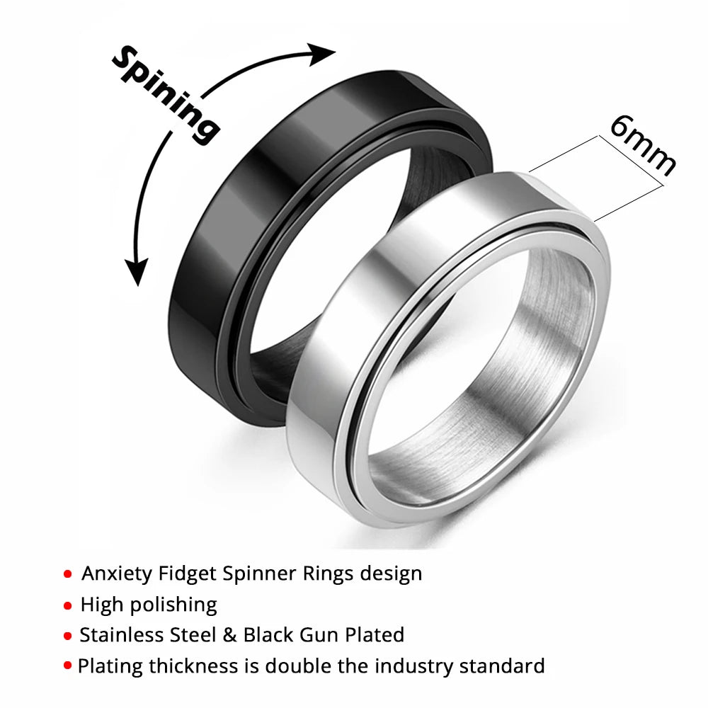 A silver stainless steel ring with a black gun plating is shown spinning.