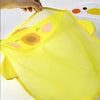 A bright yellow mesh bag shaped like a cartoon duck is being held, showing its texture and design.