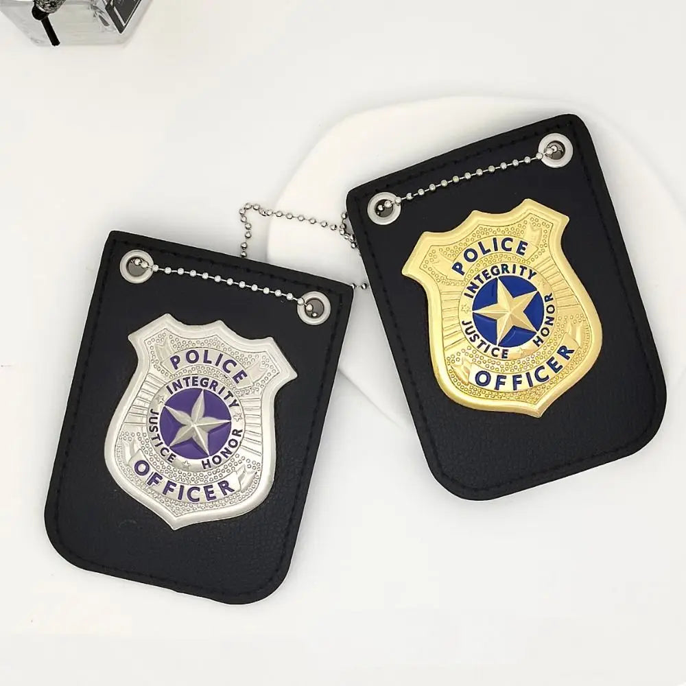 A black police badge accessory with a gold seal and blue star, featuring a chain and clip.