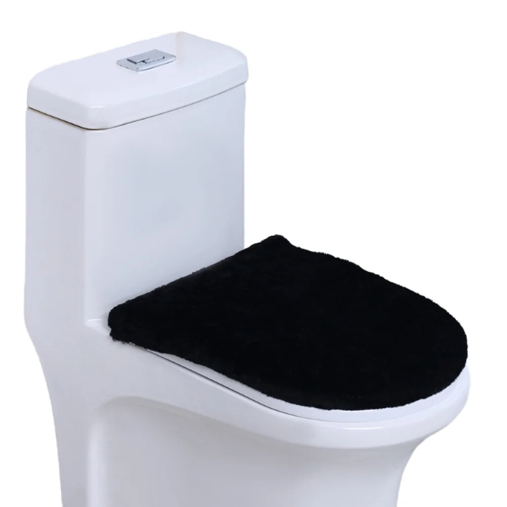 A white toilet with a black soft flannel seat cover installed.