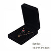 Black velvet jewelry storage box with a lid displaying a delicate gold necklace and earrings.