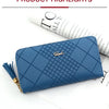 A navy blue quilted PU leather wristlet clutch wallet with a gold chain detail and tassel on a white background.