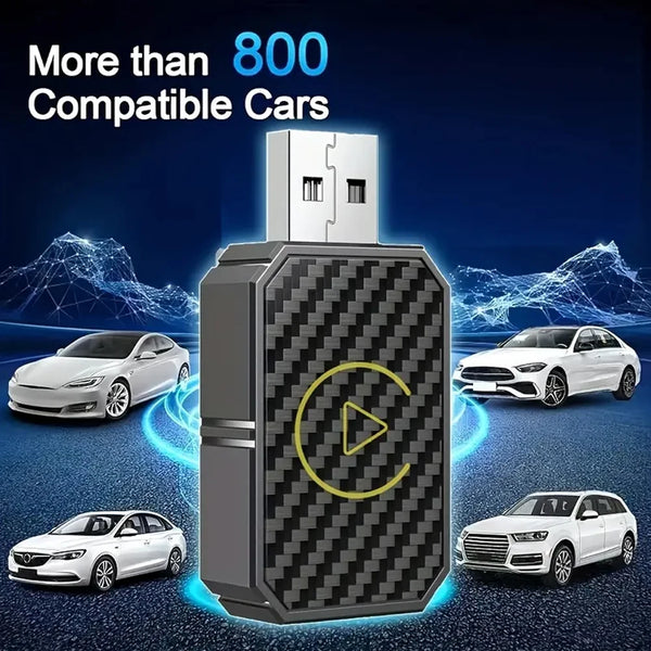 A black electronic adapter device is shown with a white box on top, surrounded by several white cars.