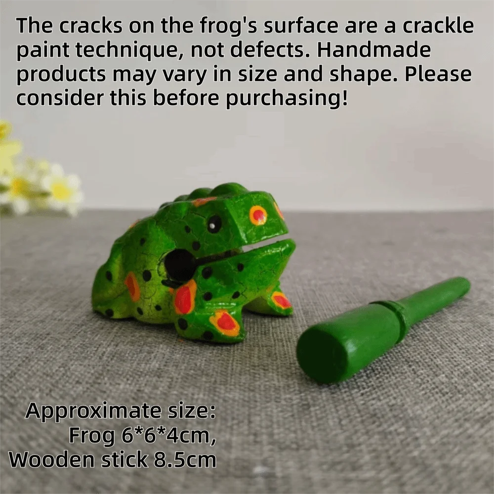 A handcrafted wooden frog percussion instrument with green body and black spots resting on a gray surface.
