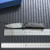 A carbon fiber folding knife with an axis lock is shown next to a ruler for scale.