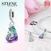 Silver pendant featuring a unicorn pegasus charm with sparkling rainbow crystals and a diamond-cut bail.