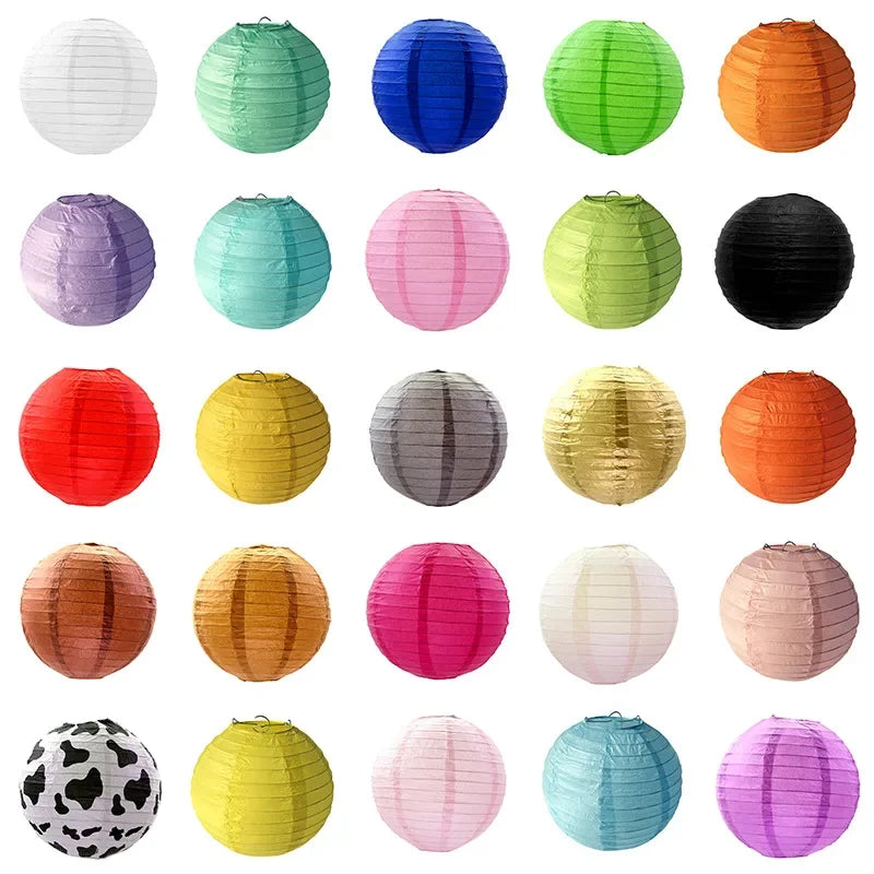 A collection of colorful round paper lanterns in various shades including green, blue, pink, orange, and yellow.
