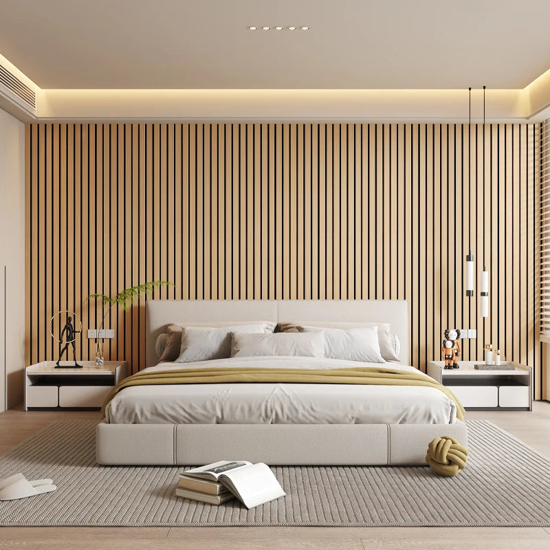 A modern bedroom featuring a light wood slat wall, white bedding, and neutral tones.