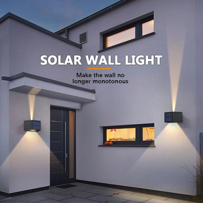 A modern house exterior showing a solar wall light illuminating the facade and a window.