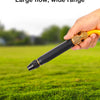 A hand holds a black and gold high-pressure water gun, demonstrating its large flow and wide range capability on green grass.