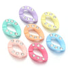 A set of acrylic jewelry connector clasps in various pastel colors, including purple, yellow, mint green, and pink.