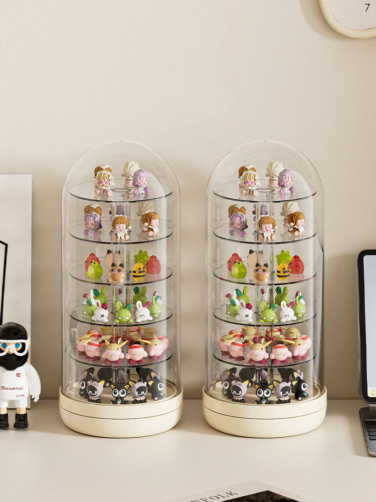 A pair of clear, rotating display cases filled with small collectible figures and keepsakes.